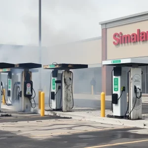 Charred Tesla charging stations at a shopping center in Littleton.