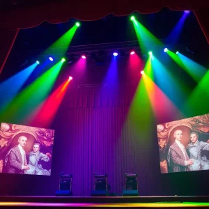 Lucy Dacus performing at the MGM Music Hall with vivid stage visuals.