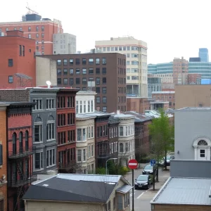 View of Boston neighborhood with various housing styles and empty office spaces.