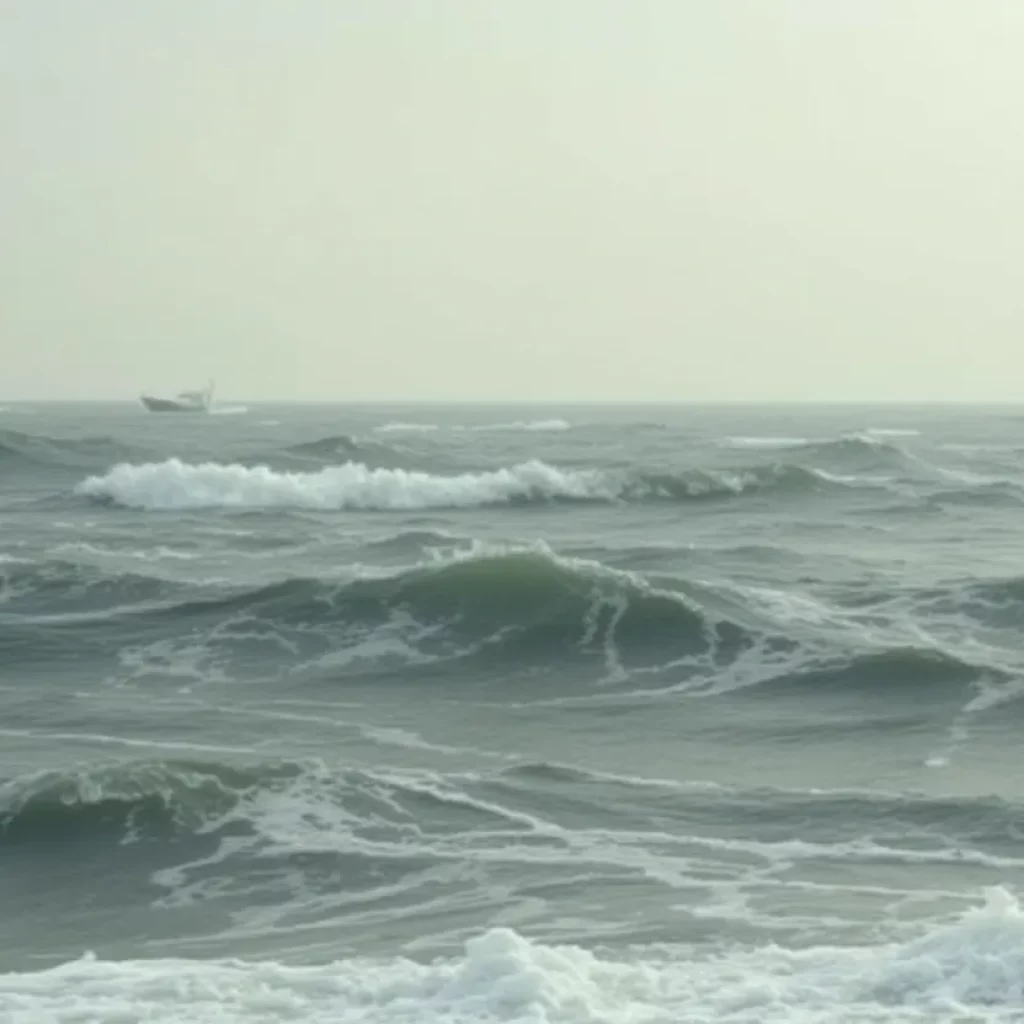 Capsized boat in rough waters off Salisbury Beach