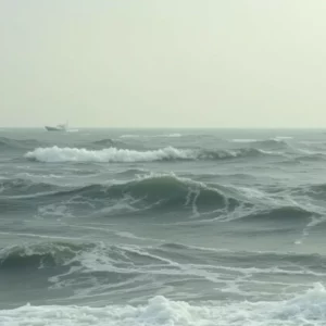 Capsized boat in rough waters off Salisbury Beach