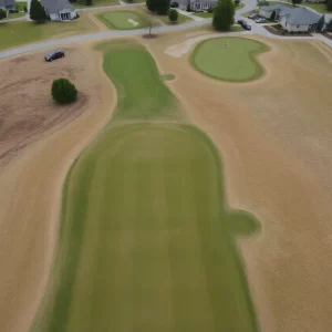 Aerial view of a golf course showing signs of poor maintenance.
