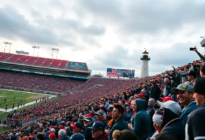Crowd at Gillette Stadium during the Patriots game with a lighthouse in the background