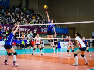 Fans cheering for Boston College volleyball team during a match
