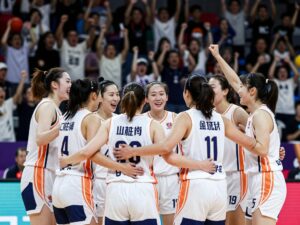 Northeastern women's basketball team celebrating their victory
