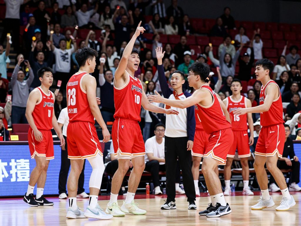 Players competing in a college basketball game between UMass and Kent State.