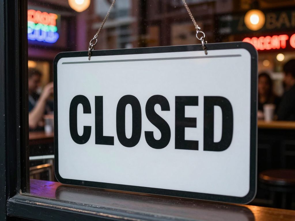 Closure sign in front of The Draft Bar and Grille in Boston